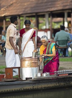 Tealady, 83 years old, making Indian tea on her boat, Backwaters, Kumarakom, Kerala, India, Asia