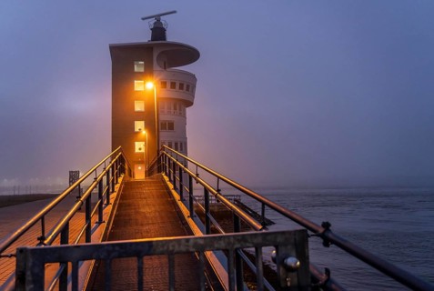 Thick fog in winter, hanging over the mouth of the Elbe into the North Sea, radar tower of the