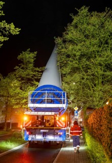 Transport of a 68 metre long, 22 tonne blade of a wind turbine, here in Breckerfeld-Waldbauer, with