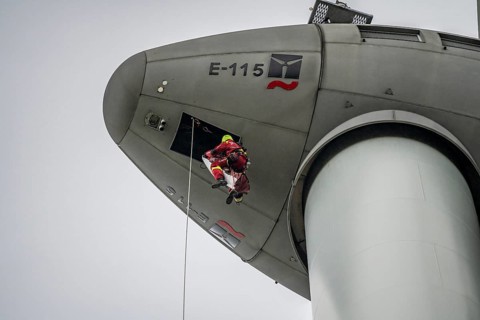 Height rescuers from the Oberhausen professional fire brigade practise abseiling from a wind
