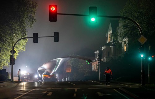 Transport of a 68 metre long, 22 tonne blade of a wind turbine, here in Breckerfeld, with a
