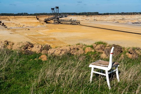 Edge of the Garzweiler II open-cast lignite mine, the last buildings of the abandoned village are