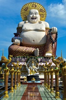Laughing Buddha, larger-than-life statue in the Buddhist temple Wat Plai Laem, Koh Samui, Thailand,
