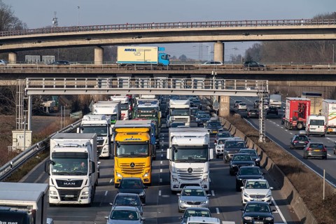 Traffic jam on the A3 motorway, at the Köln-Ost junction, heading south, four lanes jammed with