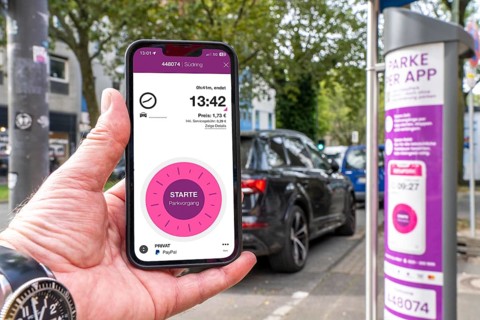 Parking in public spaces via parking app, EasyPark, here in Bochum, parking ticket machine where