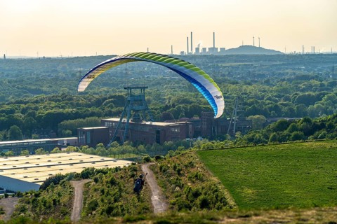 Paragliders on the Hoheward spoil tip, view to the west, North Rhine-Westphalia, Germany,