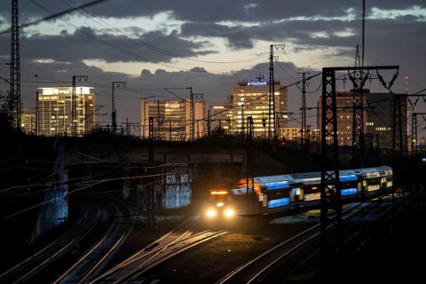 Skyline of Essen city centre, railway facilities in front of the main station, regional train,