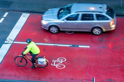 Cycle lane, space for cyclists at a traffic light crossing, marked red, cars, lorries must stop