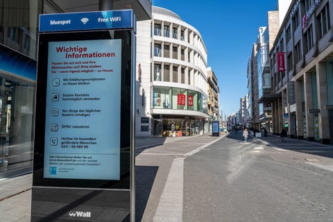 Advertising displays, give advice on correct behaviour, empty city centre, shopping street,