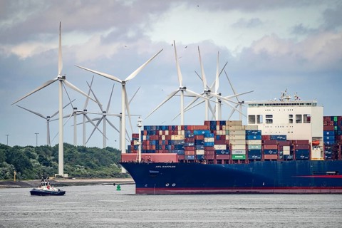 Entrance to the seaport of Rotterdam, APL Raffles container freighter, entering Maasvlakte 2, wind