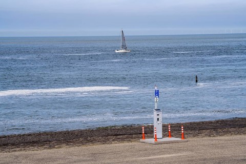 Westkapelse Zeedijk, North Sea dyke in Zeeland, can be used as a car park, parking ticket machine,