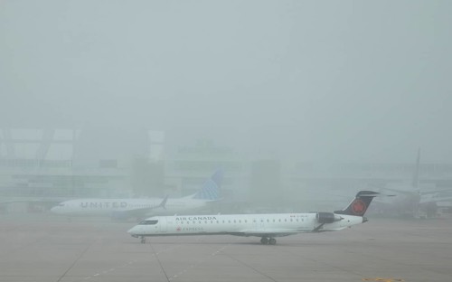 Denver, Colorado, Airliners on the ground in foggy weather at Denver International Airport (DEN)