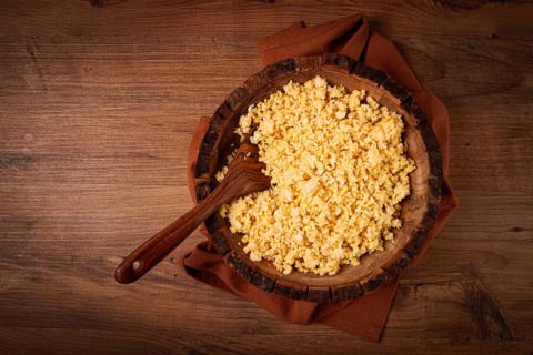 Cooked couscous, in a wooden bowl, top view, no people