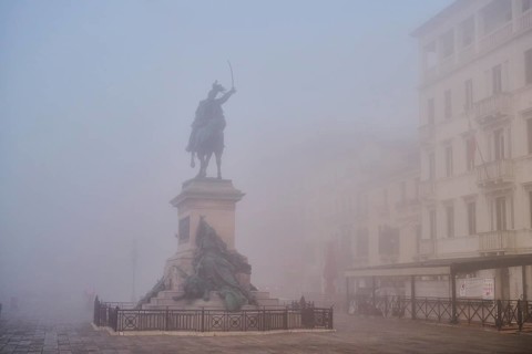 View from 'Riva degli schiavoni' on 'Monumento a Vittorio Emanuee II' before sunrise in Venice on a