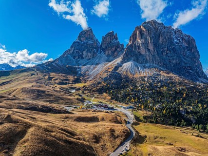 The peaks of the Sassolungo Group, Passo Sella, drone shot, Val Gardena, Dolomites, Autonomous