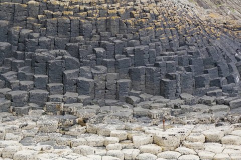 Close-up view of hexagonal basalt columns and rocks on the coast, Hebridean Overture, Isle of