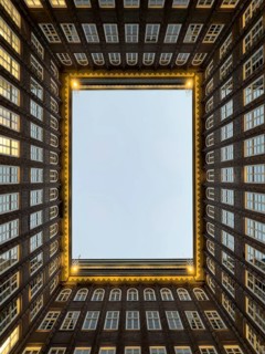 Illuminated inner courtyard of the Kontorhaus Chilehaus in Hamburg's Kontorhaus district at the