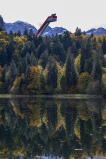 Freibergsee lake in autumn, behind it the Heni-Klopfer ski jump, Allgäu Alps, Allgäu, Bavaria,