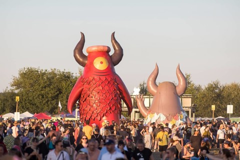 Festival visitors in front of the Highfield mascot Highviech at the Highfield Festival on Friday,
