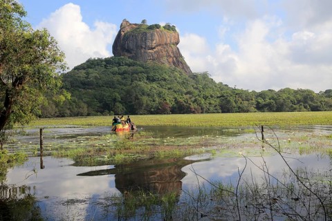 Elephant ride in lake by rock palace, Sigiriya, Central Province, Sri Lanka, Asia
