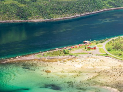 View from mountain range above village Raften down to shore at the Raftsund, the strait between