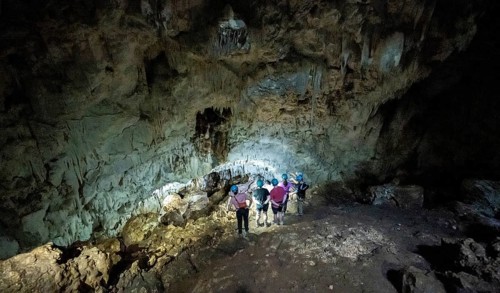 Tourists in a stalactite cave, Terciopelo Cave, Barra Honda National Park, Costa Rica, Central