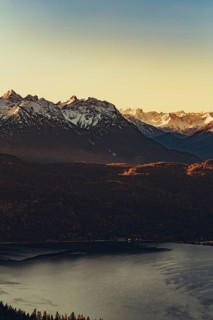 Trail running in autumn on the Jochberg on Lake Walchensee against the wonderful backdrop of the