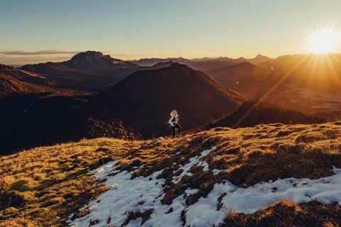 Trail running in autumn on the Jochberg on Lake Walchensee against the wonderful backdrop of the
