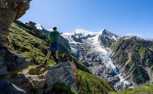 Mountaineer in front of mountain landscape, view of glacier Glacier de Taconnaz, hike La Jonction,