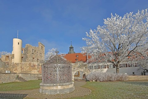 Inner courtyard and Kindlesbrunnen fountain decorated with metal grating, medieval, iron grating,
