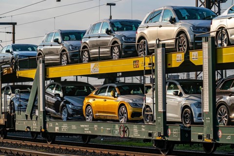 VW plant, Emden, new cars, car transporter, car train, goods train, with VW vehicles, Lower Saxony,