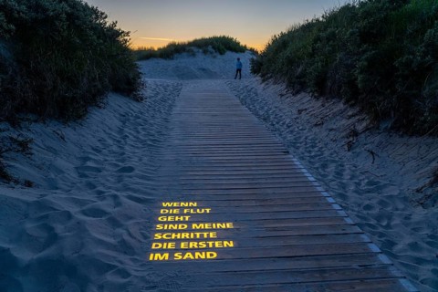 North Sea island Langeoog, beach access with luminous poem, light installation, When the tide goes