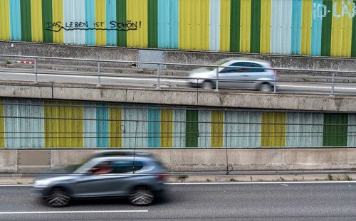 Motorway A40, Ruhrschnellweg, in the through road in Essen, noise barrier, with the slogan, life is