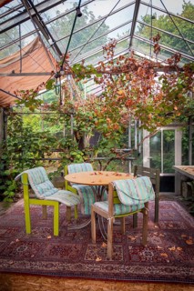 Greenhouse, conservatory with vintage-look seating, interior design, lifestyle, retro, alternative