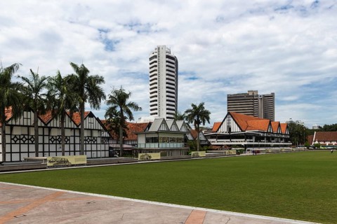 Modern buildings and green field in the city centre of Kuala Lumpur, Malaysia, Asia