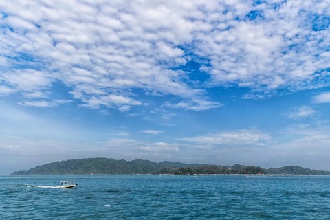Tropical island and blue sky with clouds in the marine reserve