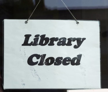 Sign saying 'Library Closed' symbolising closure of libraries as a result of austerity government