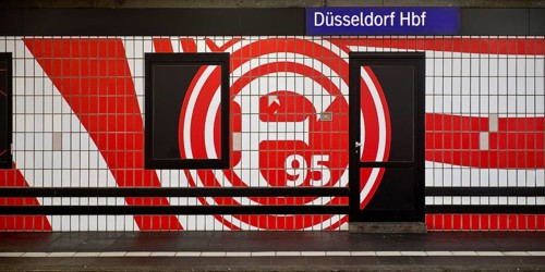 Large logo in club colours of Fortuna Düsseldorf on a wall with tiles, Düsseldorf Central Station,