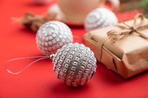 Christmas or New Year composition. Decorations, box, cinnamon, silver balls, fir and spruce