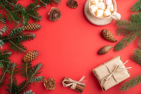 Christmas or New Year frame composition. Decorations, box, cinnamon, cones, fir and spruce