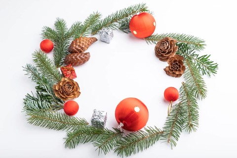 Christmas or New Year wreath composition. Decorations, balls, cones, fir and spruce branches, on