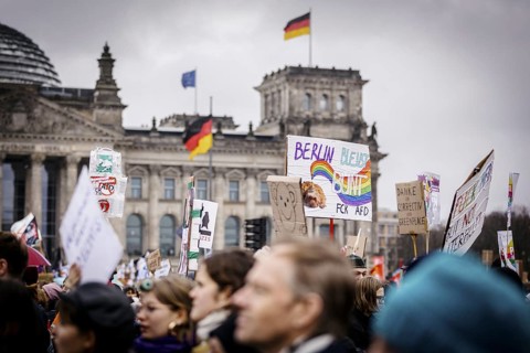 Posters at the large demonstration against the right in Berlin under the slogan We are the firewall