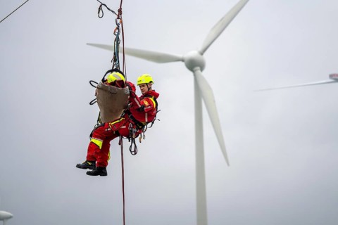 Height rescuers from the Oberhausen professional fire brigade practise abseiling from a wind