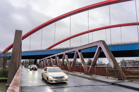 Dilapidated A42 motorway bridge (red arches) over the Rhine-Herne Canal, with massive structural