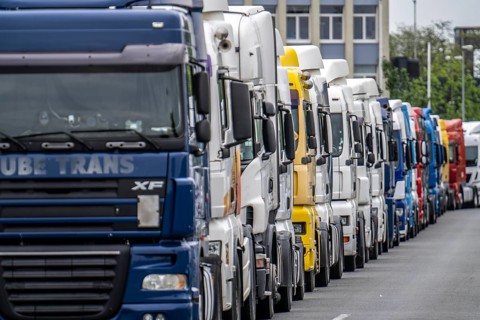 Truck tractors, exclusively from Eastern European countries, park in the harbour area, the canal