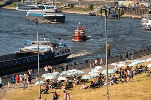 The city beach on the Rhine near Düsseldorf, riverside promenade, by the Rheinkniebrücke bridge,