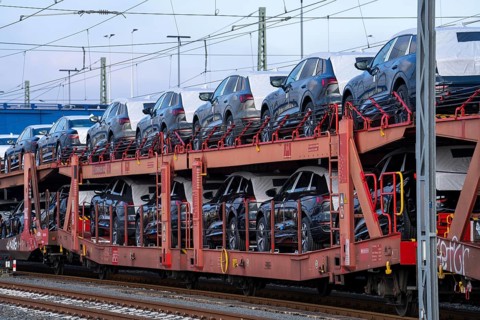 Car train, goods train on its way to the car terminal in Bremerhaven seaport, new German cars for