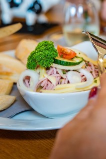 Close-up of sausage salad with onions, cheese and parsley in a bowl, autumn creations, Cafe Kuh,