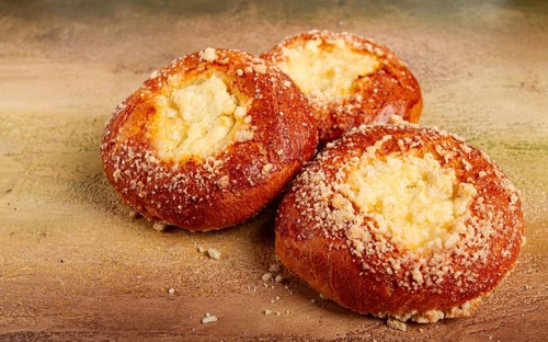 Bun with cottage cheese, pastries, cheesecake, no people