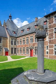 1758 pillory in courtyard at Kasteel van Laarne, 14th century medieval moated castle near Ghent,
